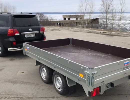Прицеп бортовой двухосный с тормозом ССТ-7132-28 (платформа Ш=1821 мм) Прицеп бортовой двухосный с тормозом ССТ-7132-28 (платформа Ш=1821 мм)